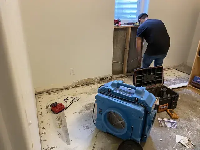 Air movers drying a finished basement in a north Utah County home