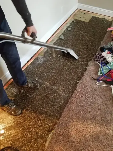 A baseboard removed after a leak in a north Utah County home