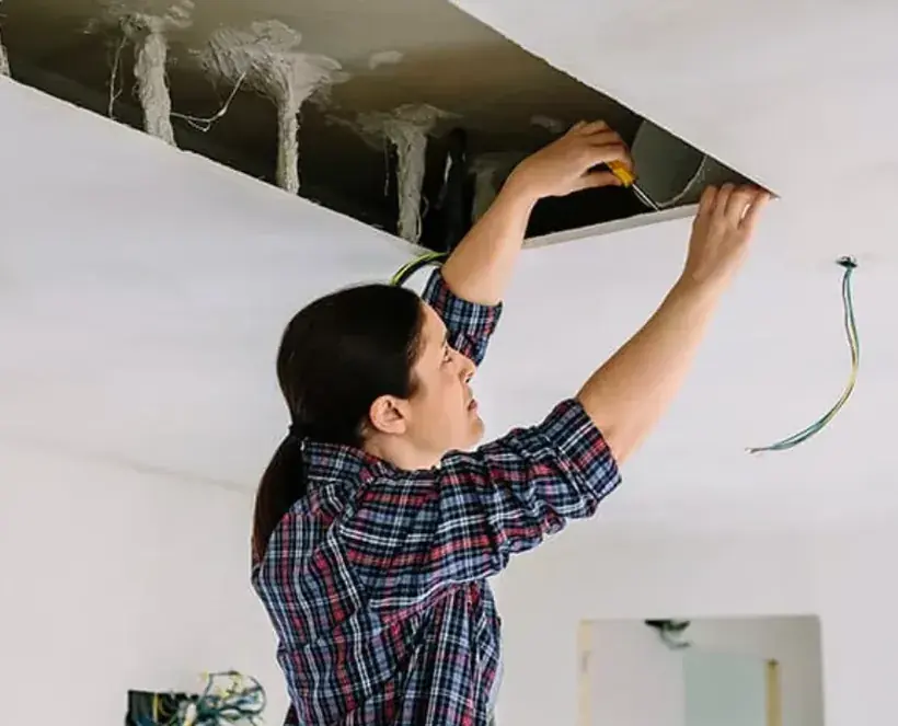 Ice dam and roof leak water damage on an Alpine ceiling